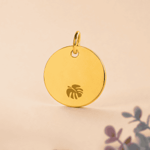Pendentif rond en or avec logo tropical, bijou élégant pour chien ou chat.
